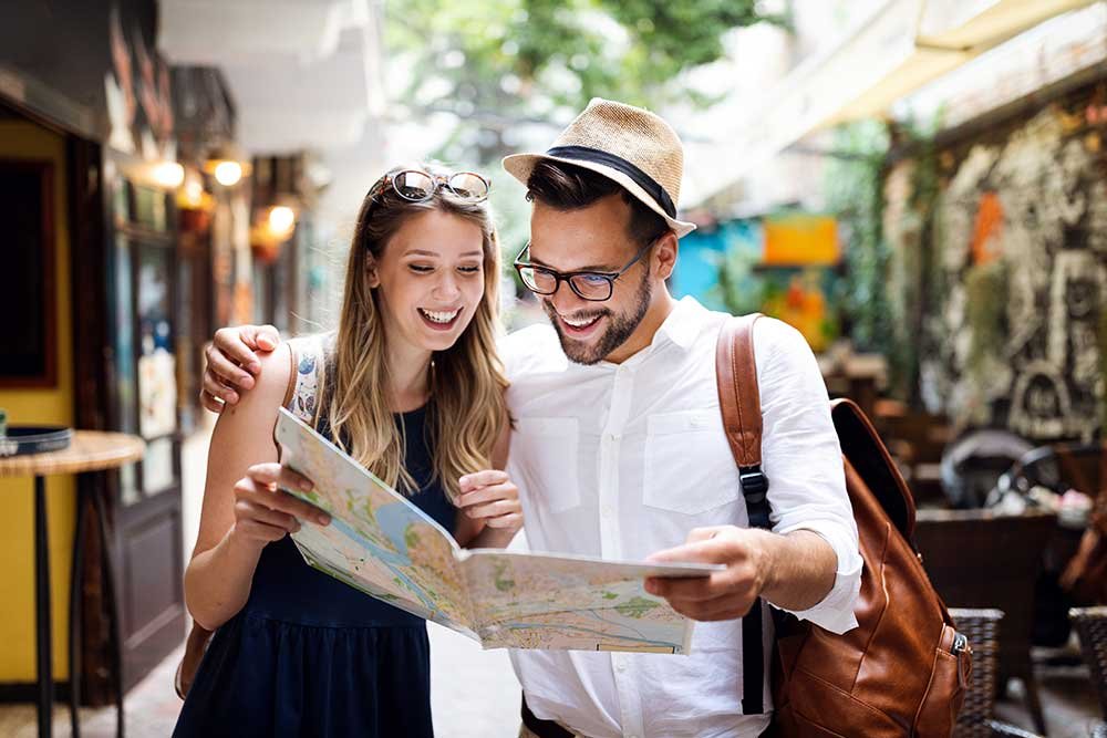 tourist couple traveling travel walking on street small.jpg